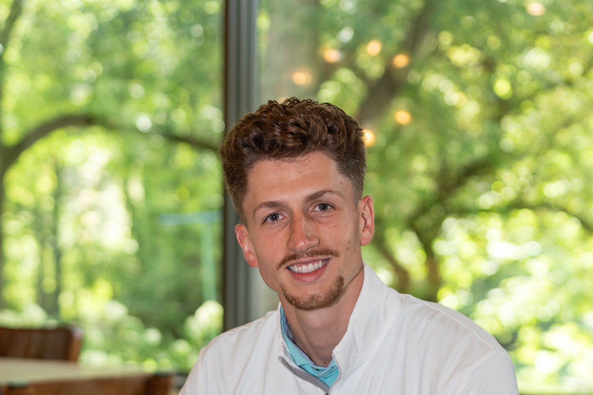 Luke Morrison of ABODE Home Concierge, seated in a client's home