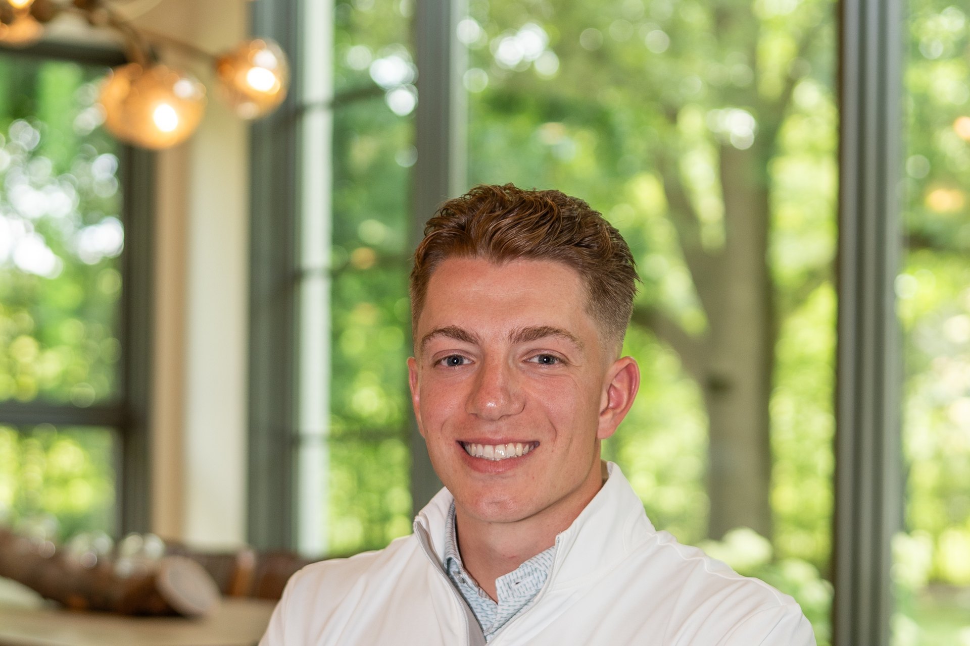 Ned Morrison of ABODE Home Concierge, seated in a client's home